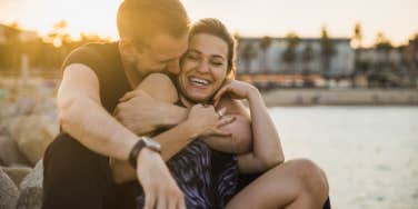 couple smiling and embracing