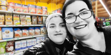 Selfie of Author and woman in baking aisle 