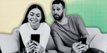 Man looking over woman’s shoulder at her phone 