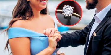 Man putting ring on woman's hand
