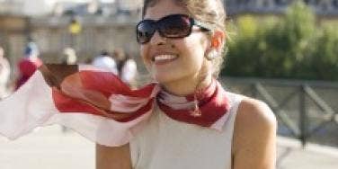 jackie kennedy Dark haired woman with sunglasses and scarf