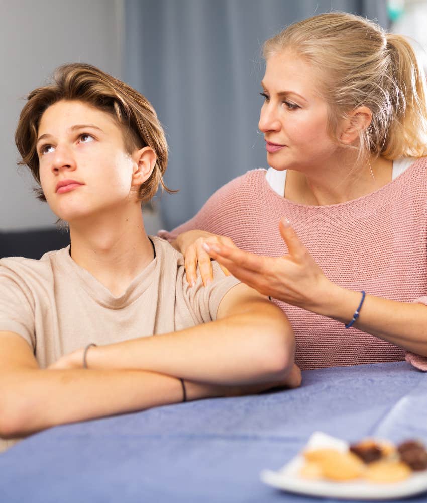 mom trying to console frustrated teen son