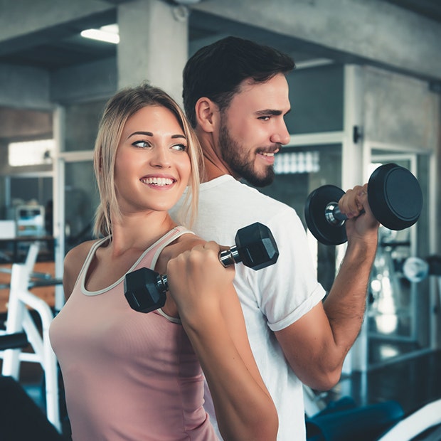 couple lifting weights