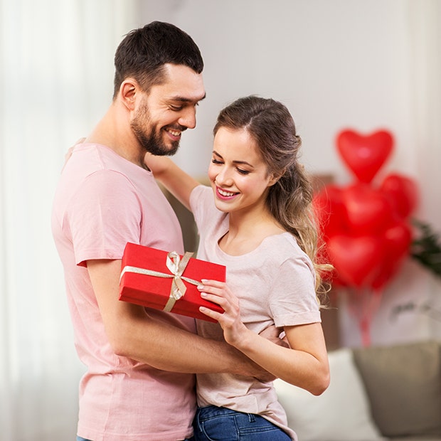 woman holding valentines gift