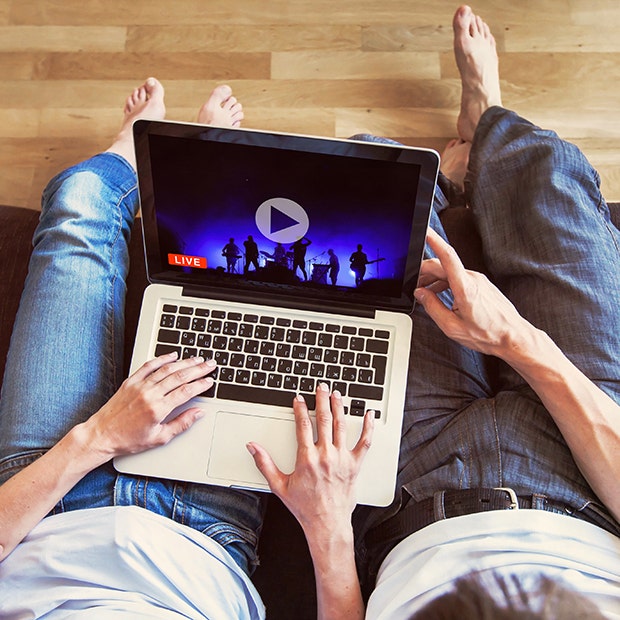 couple watching concert on a computer