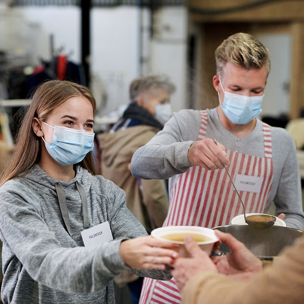 people passing out soup