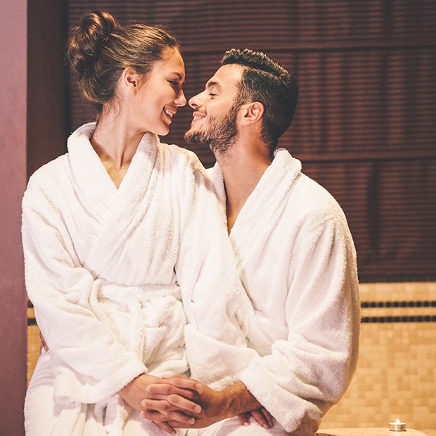 couple smiling in bathrobes