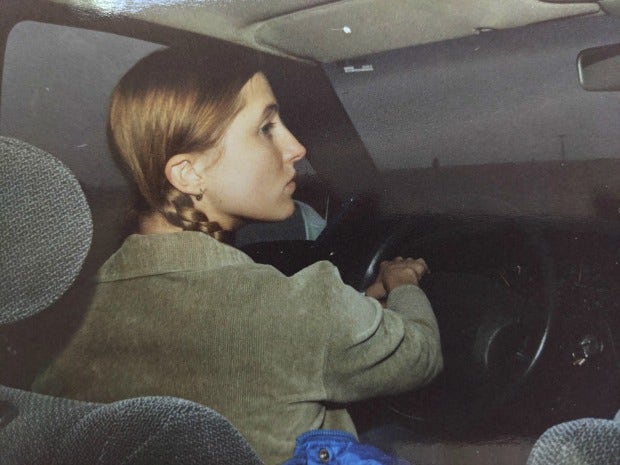 Joanna Schroeder, age 20, with reddish blonde hair in pigtail braids, photographed in profile