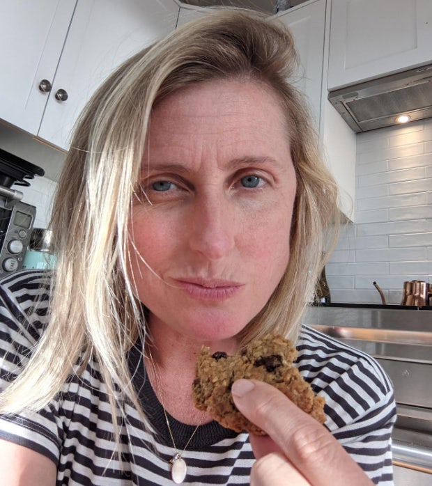 Joanna Schroeder, a 40-something blonde white woman, looks at camera