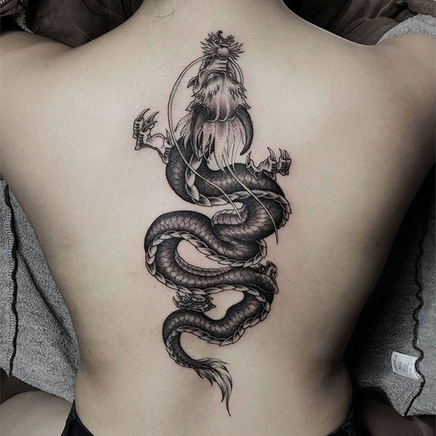 Black and gray dragon tattoo