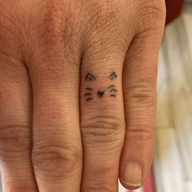 Cat wedding ring tattoo