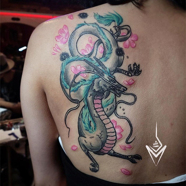 Colorful dragon back tattoo