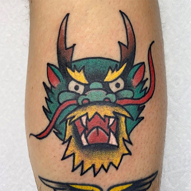 Dragon face tattoo
