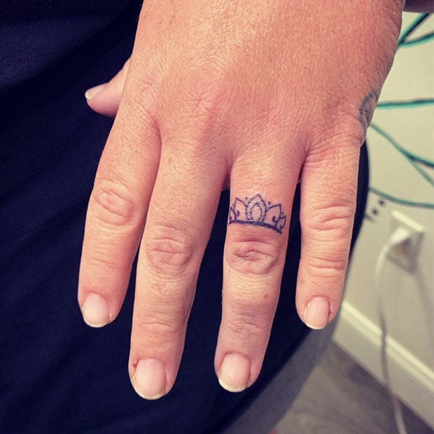 Crown wedding ring tattoo