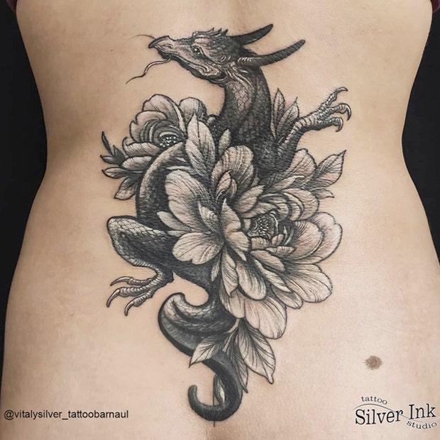 Feminine dragon tattoo on back