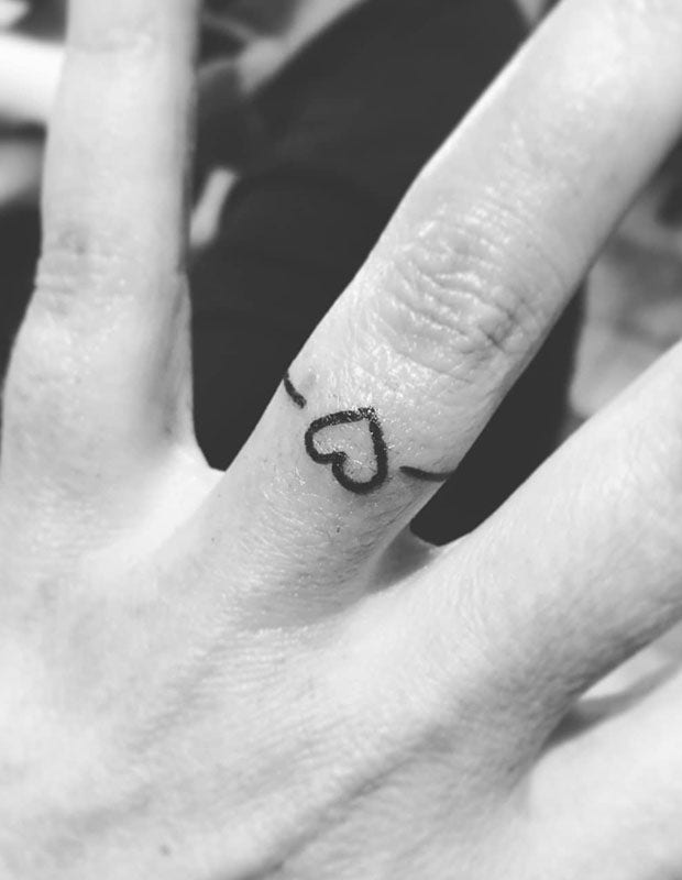 heart wedding ring tattoo