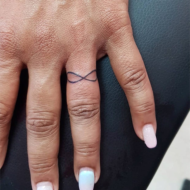 infinity sign wedding ring tattoo