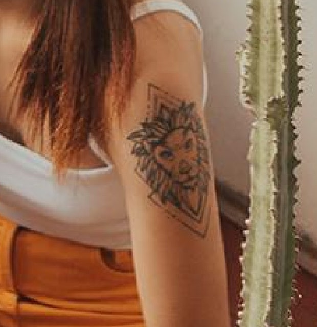lion tattoo idea for women