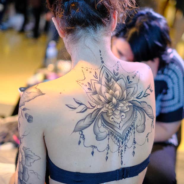 neotraditional mandala back tattoo