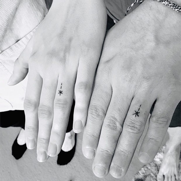 matching stars wedding ring tattoo