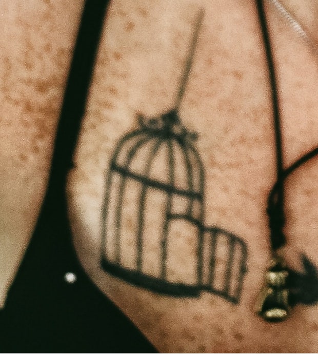 open bird cage tattoo idea for women