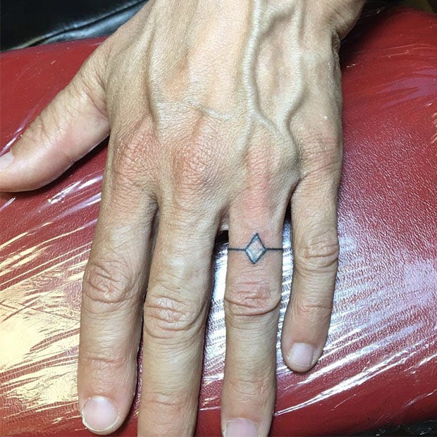 Realistic wedding ring tattoo