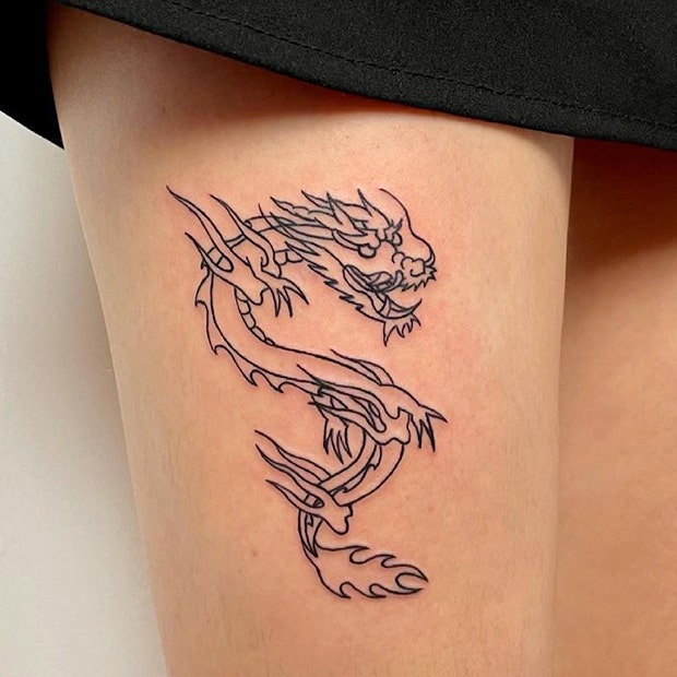 Thigh dragon tattoo