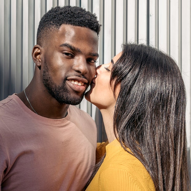 woman kissing man&#039;s cheek smiling how to kiss a guy