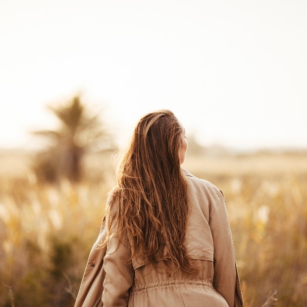 woman walking in a field