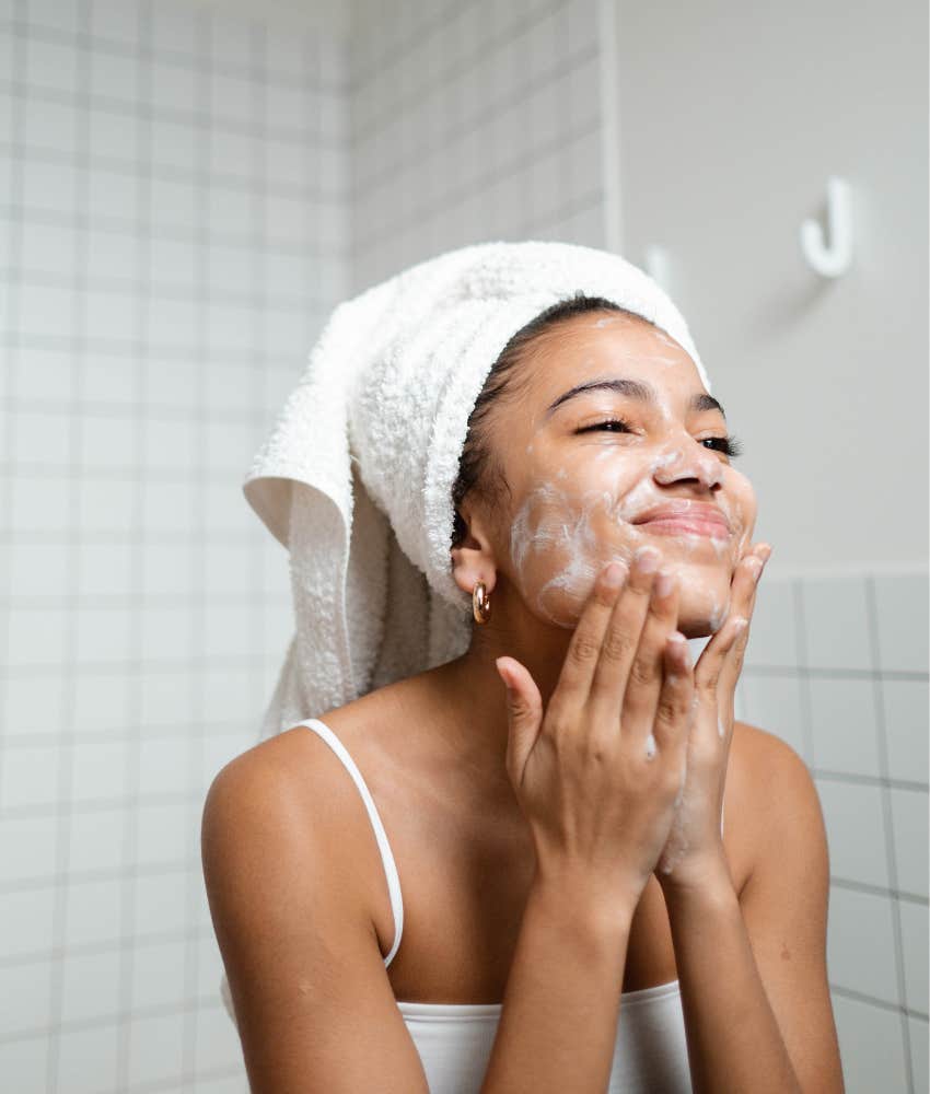 woman washing her face