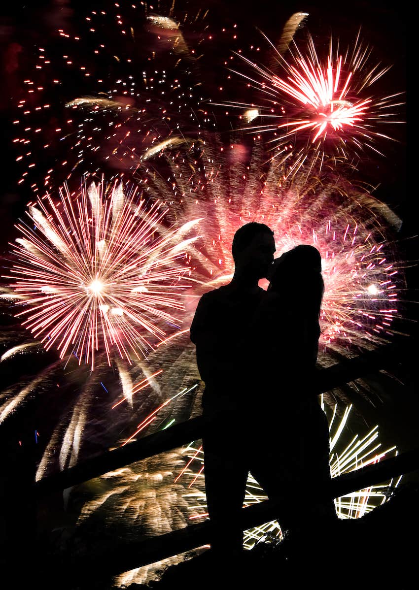 fireworks while a couple kiss