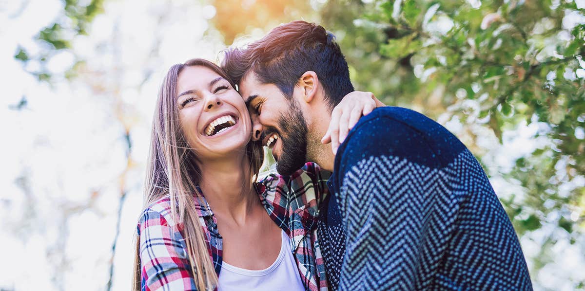 16 Men Reveal The Best Gift They Ever Received From A Woman Happy couple in love having fun outdoors and smiling.
