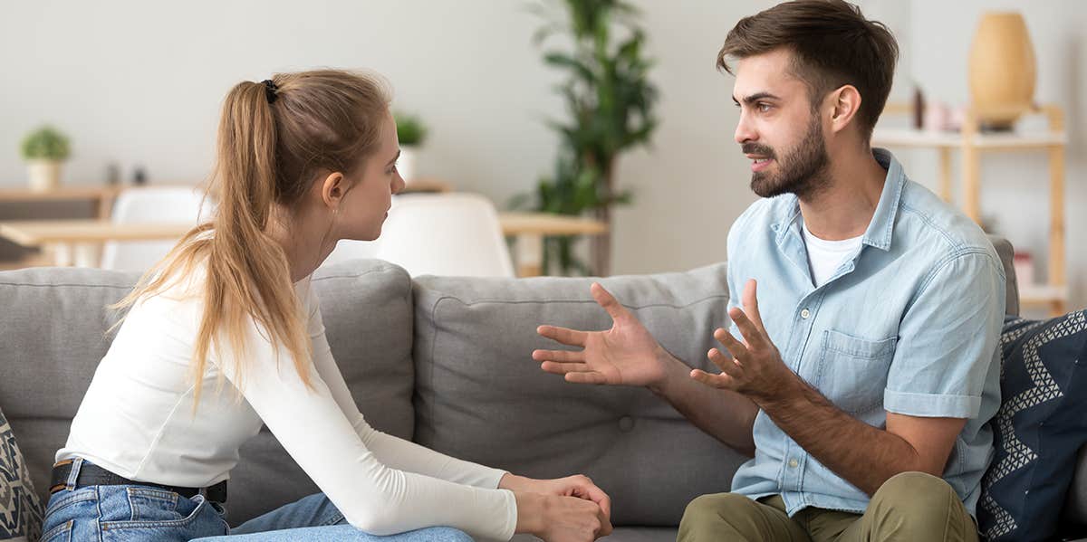 man and woman sitting down having a calm serious conversation