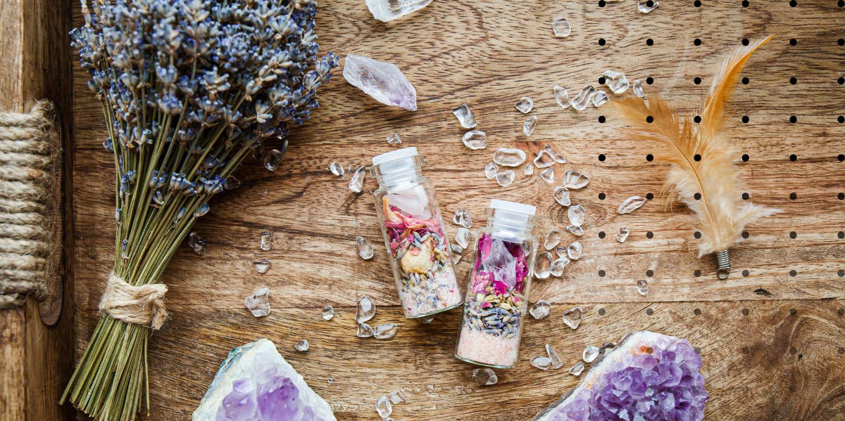 crystals, fresh flowers, lavender laid out beautifully on a table