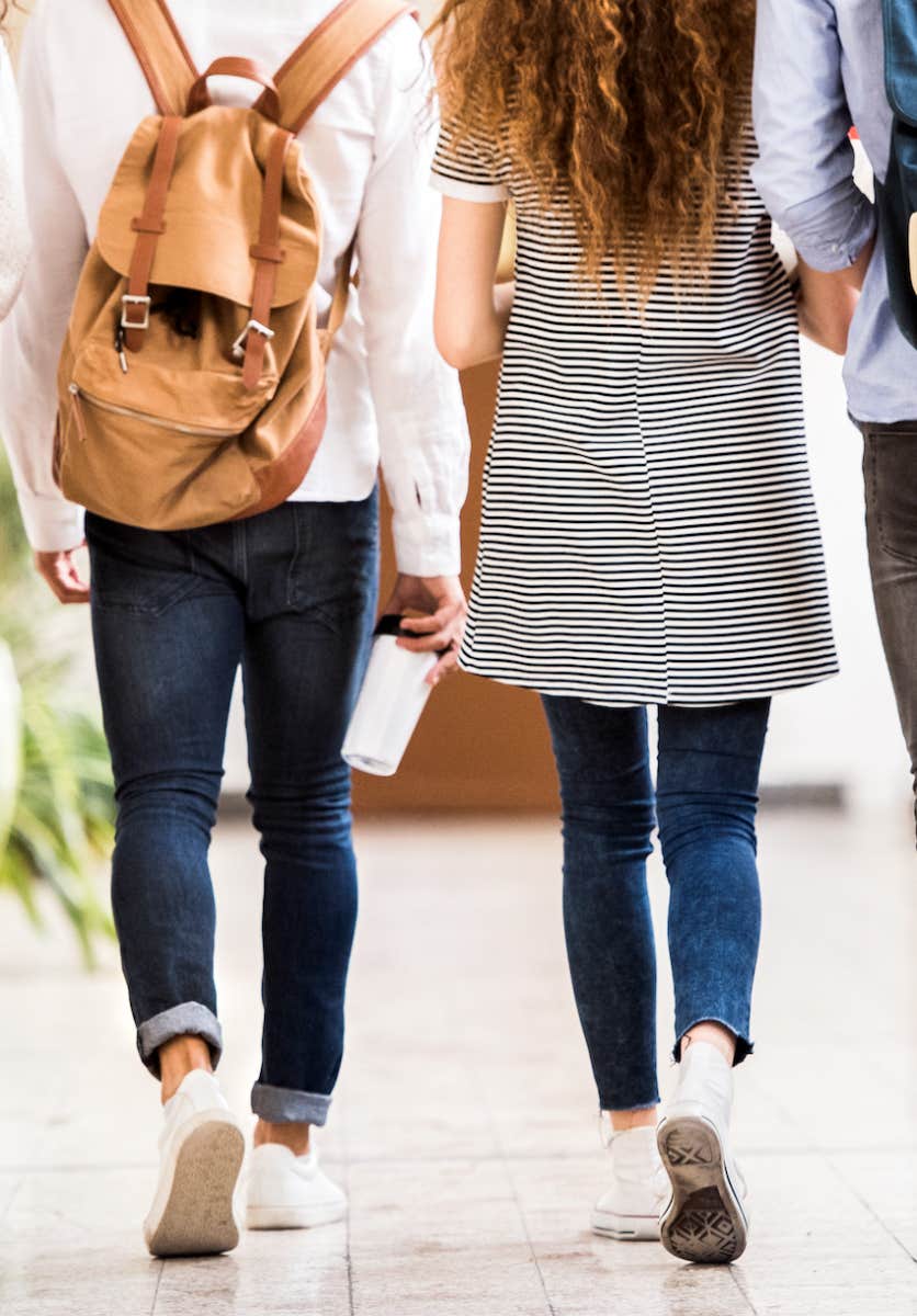 students walking in school hallway