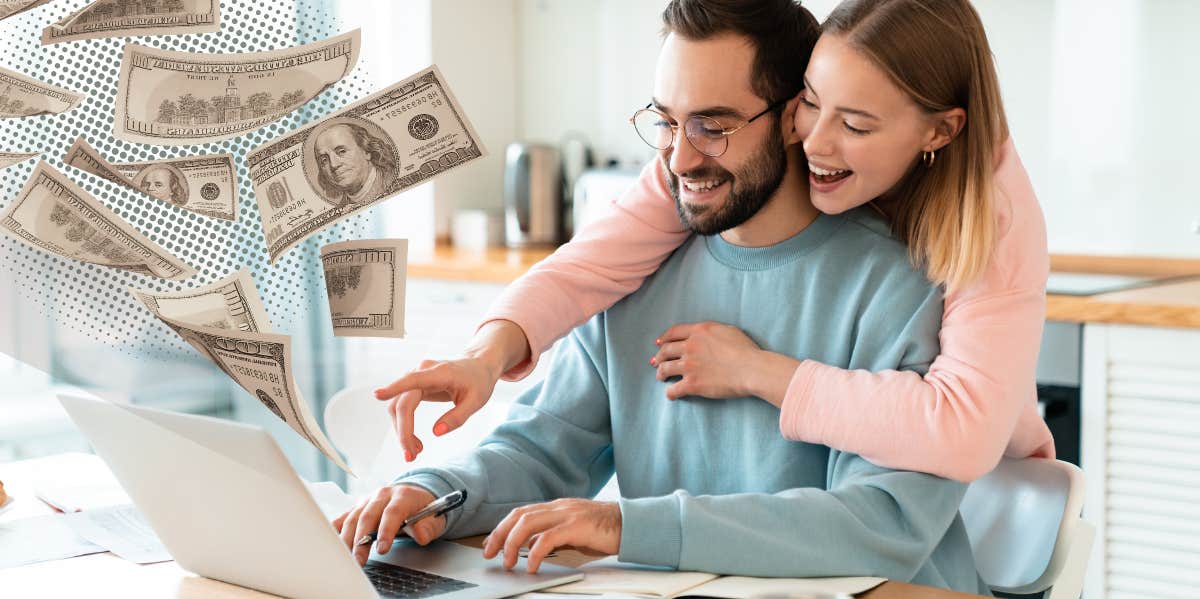 Portrait of Happy Couple Looking at Laptop