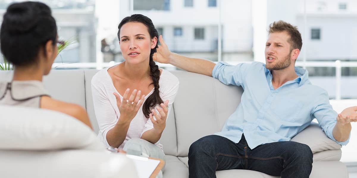 couple talking to their therapist in therapists office