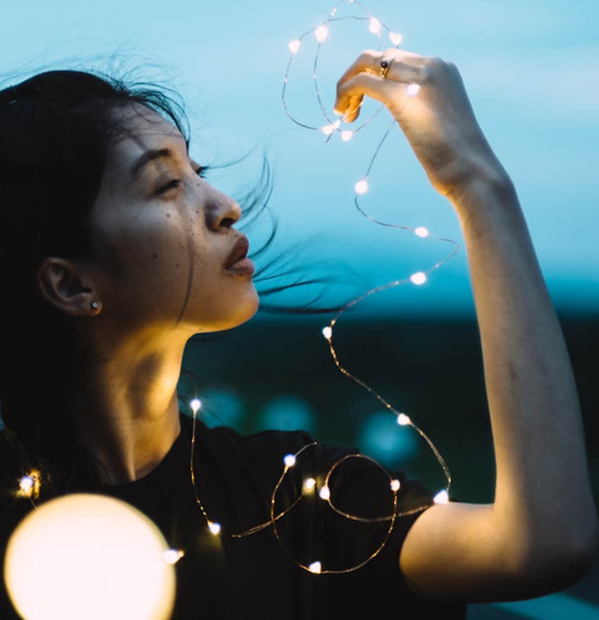 serene women plays with lights