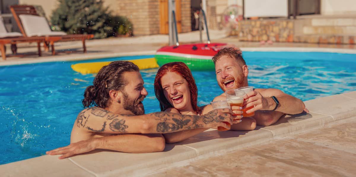 2 men and a woman laughing together