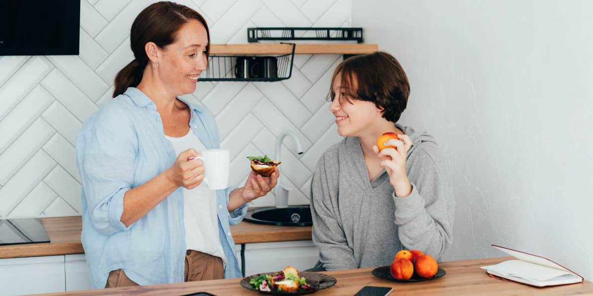 mother and son talking in kitchen with no distractions