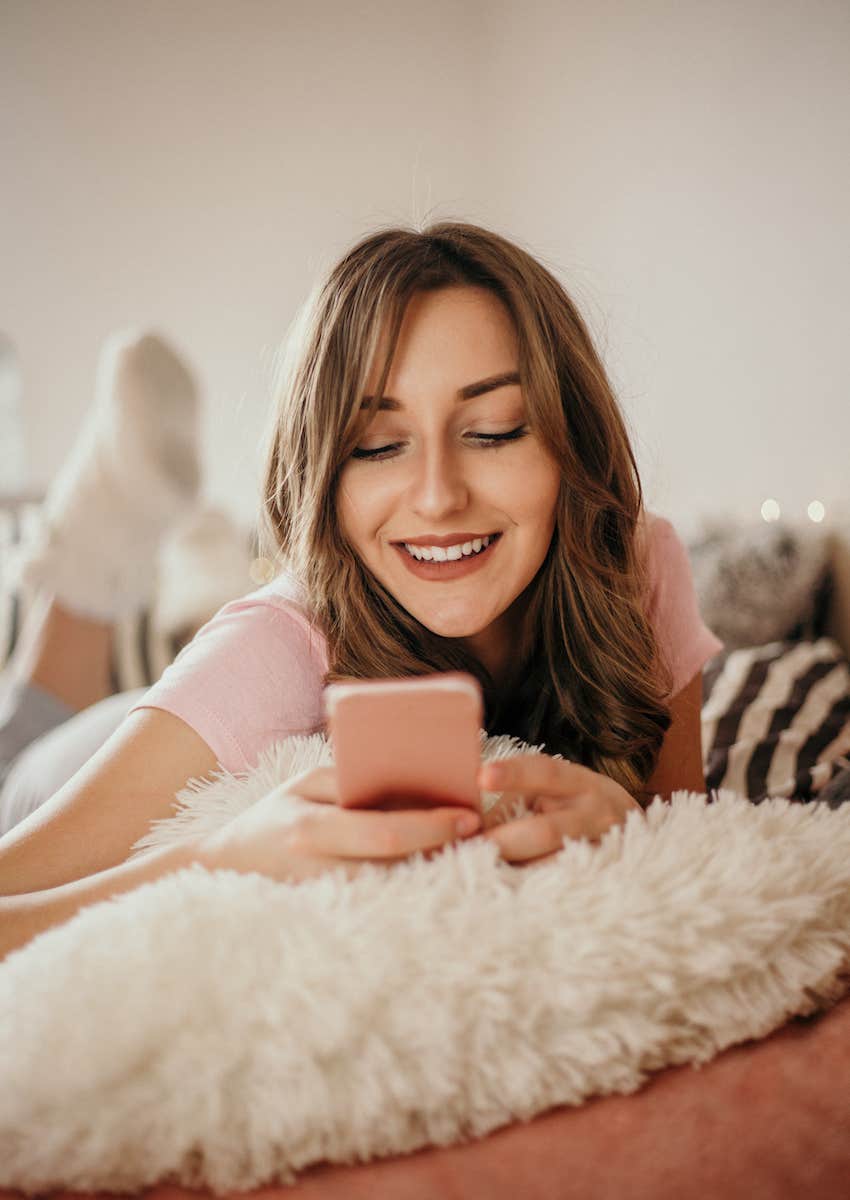happy woman receives a text message