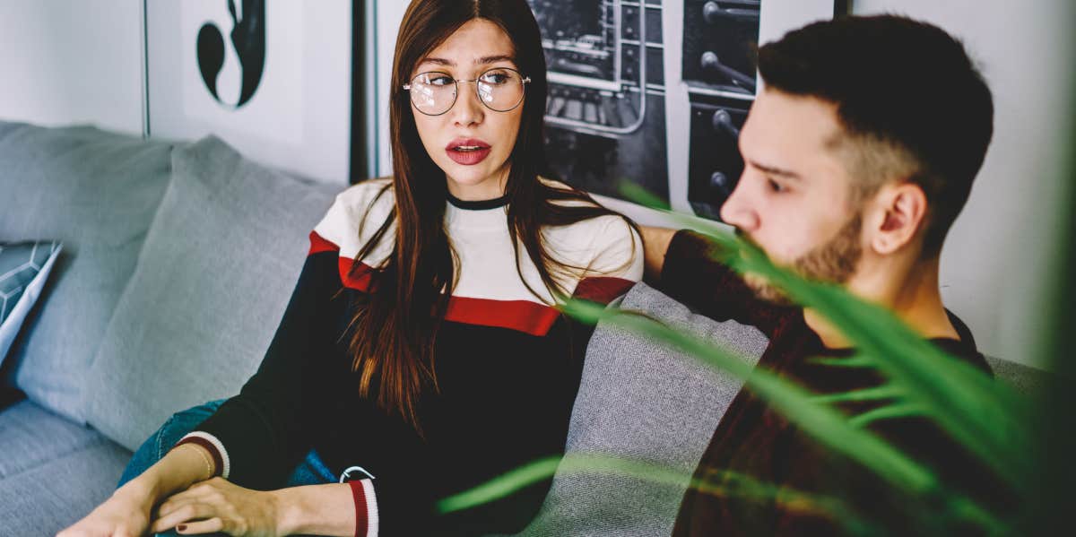 serious woman in spectacles for vision correction trying solving problems with husband