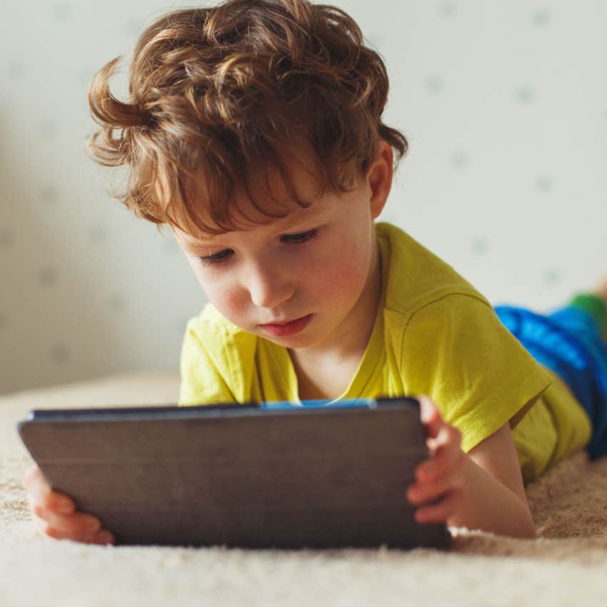 young boy using ipad