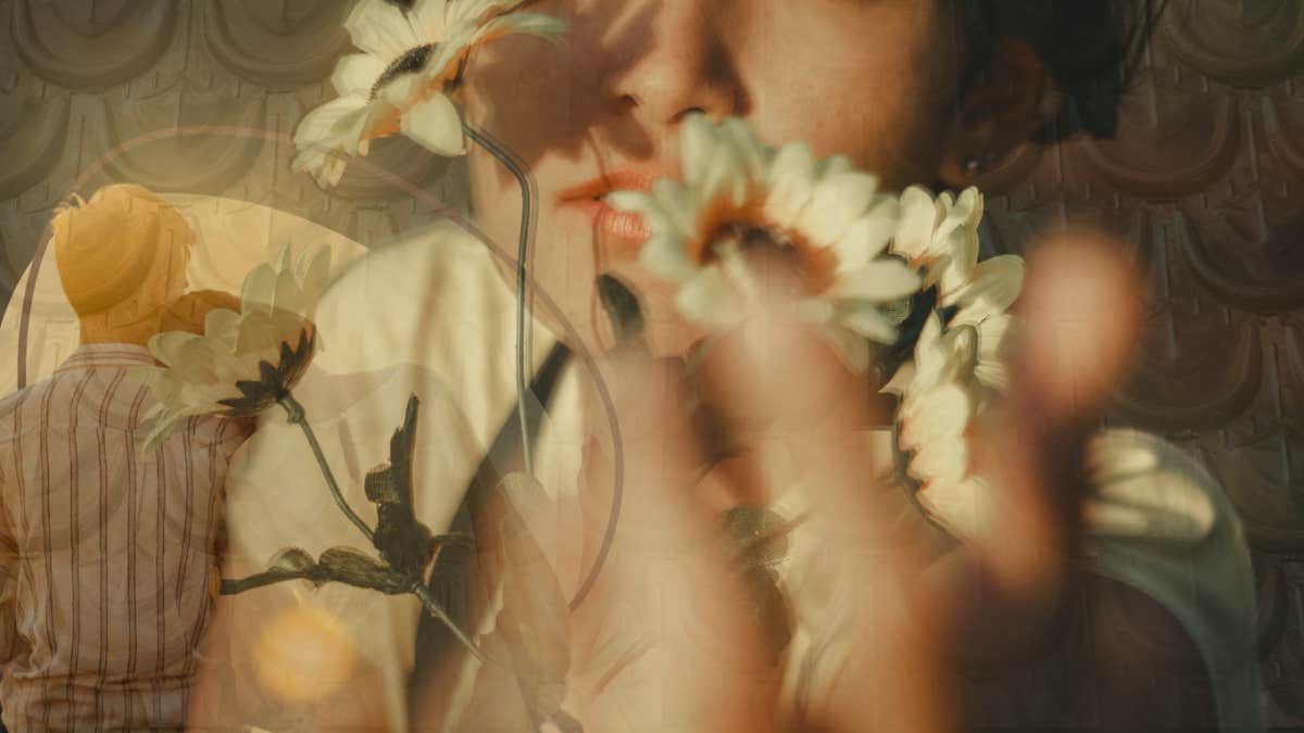 Can We Please Stop Saying Men Are Protectors Of Women? Woman holding a delicate flower much like men see 'females' as