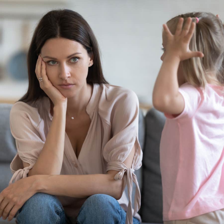 exasperated mom looking at toddler