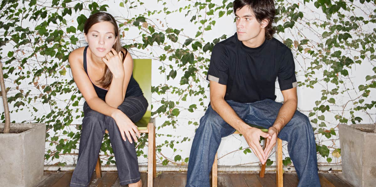 7 Harsh Signs Someone Is Using You In A Relationship boyfriend and girlfriend distanced from each other