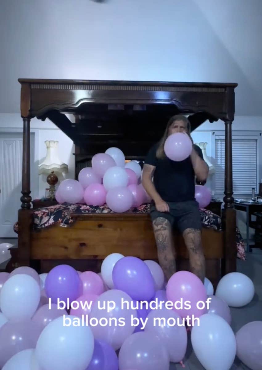 Drew Marvick blows up hundreds of balloons by mouth the night before his daughter's birthday