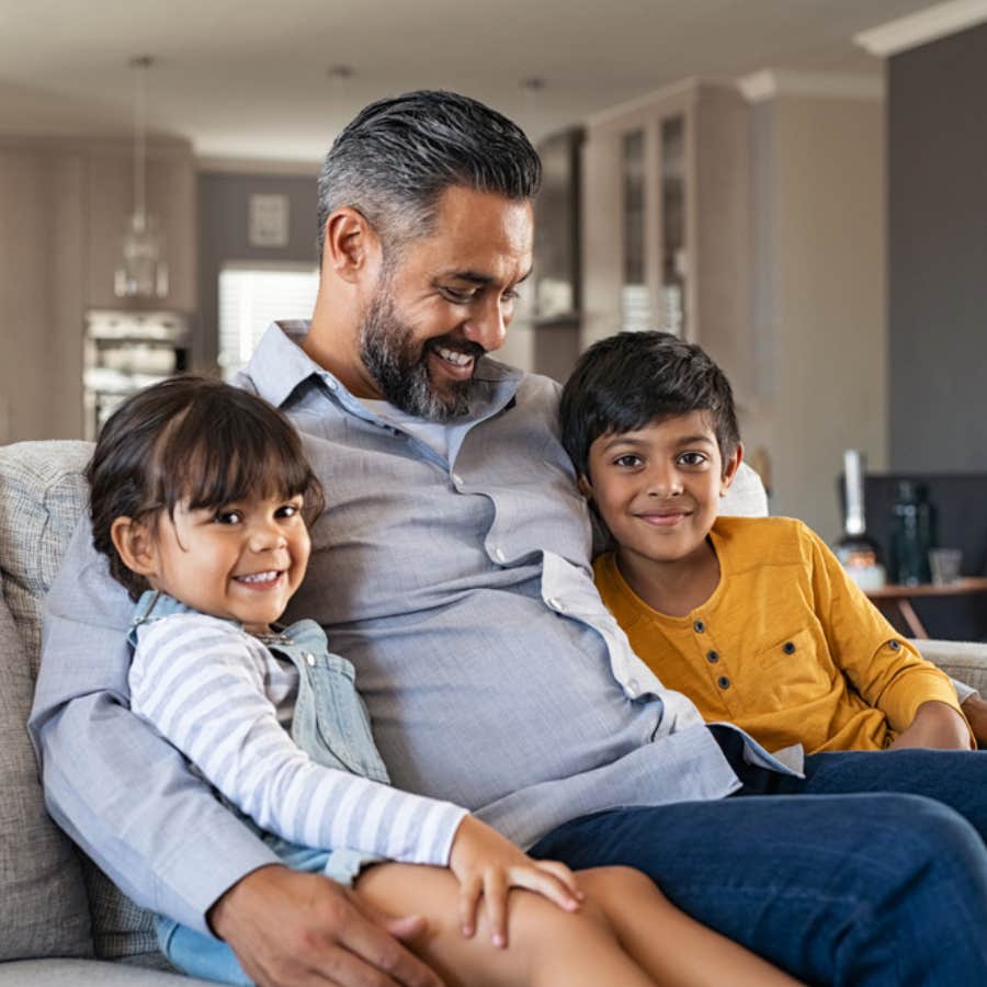 man smiling with his two kids