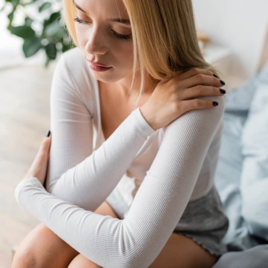 woman giving herself a hug