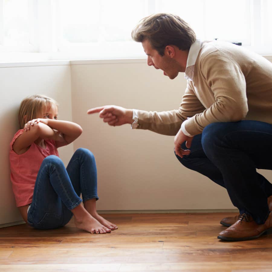 man yelling at young girl